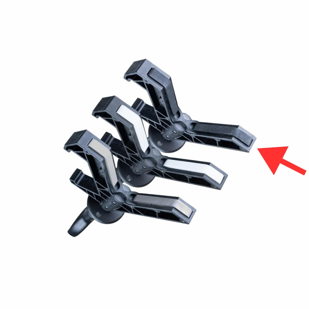 Nærbillede af sort Y-formet del af Hand Safety Tool med rød pil, der peger på komponenten.