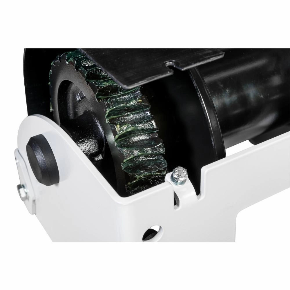 Nærbillede af tandhjulsmekanismen i et håndspil med synlig smørelse.