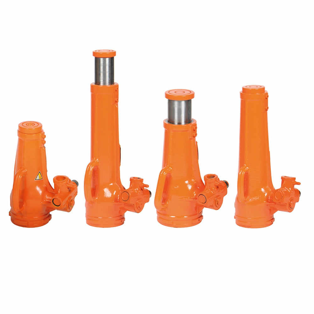 Fire orange donkrafte i forskellige højder med cylindrisk design og advarselsmærkat.
